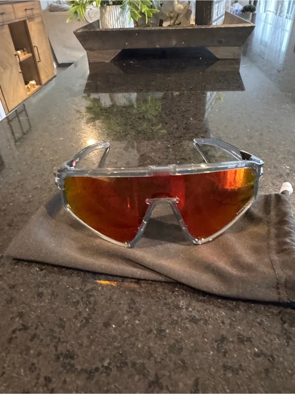 Oakley Shield Sunglasses with Red-Orange Mirrored Lens and Clear Frame